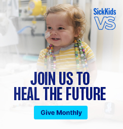 An infant wearing Bravery Beads and smiling. Join us to health the future. Give monthly.